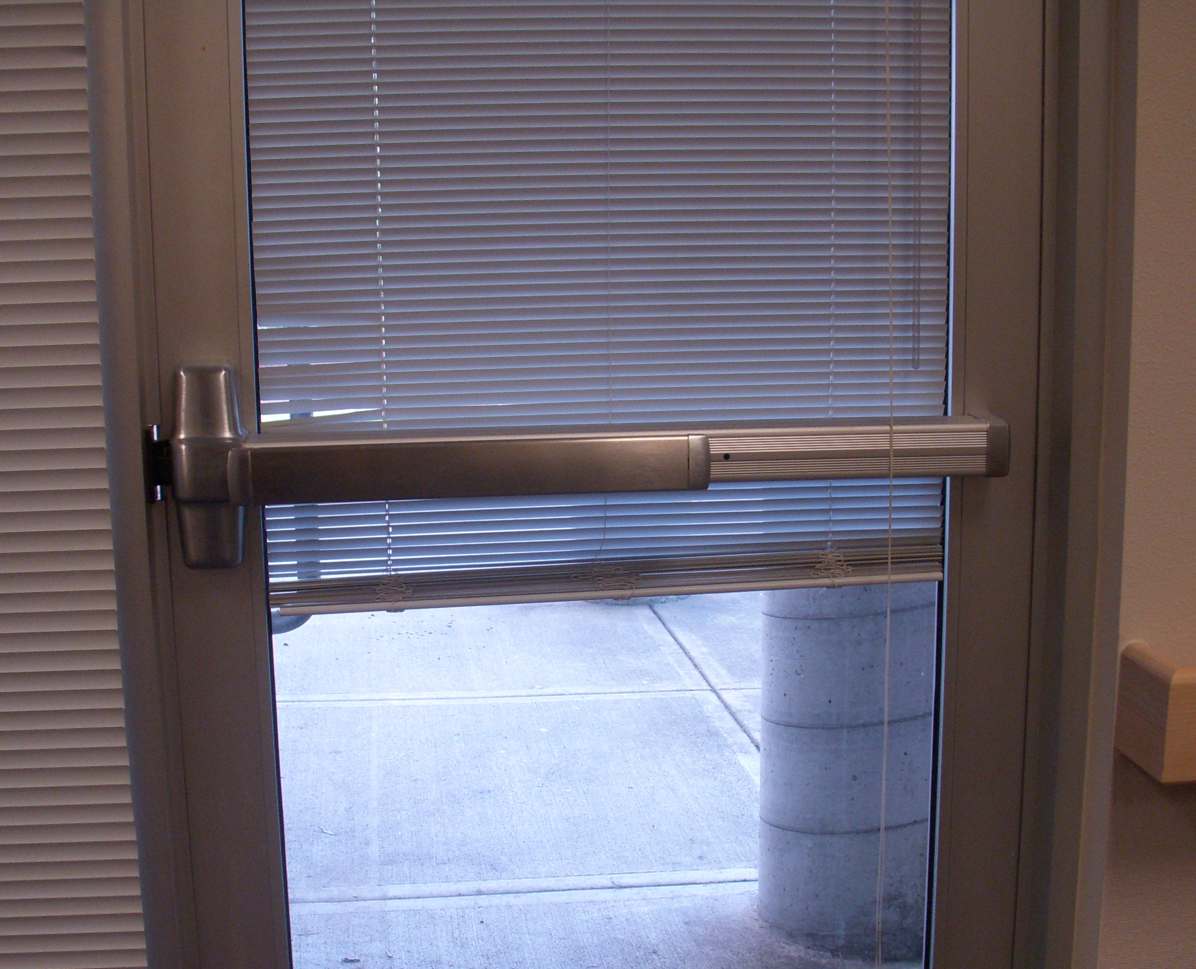 Panic bar exit device on a commercial door