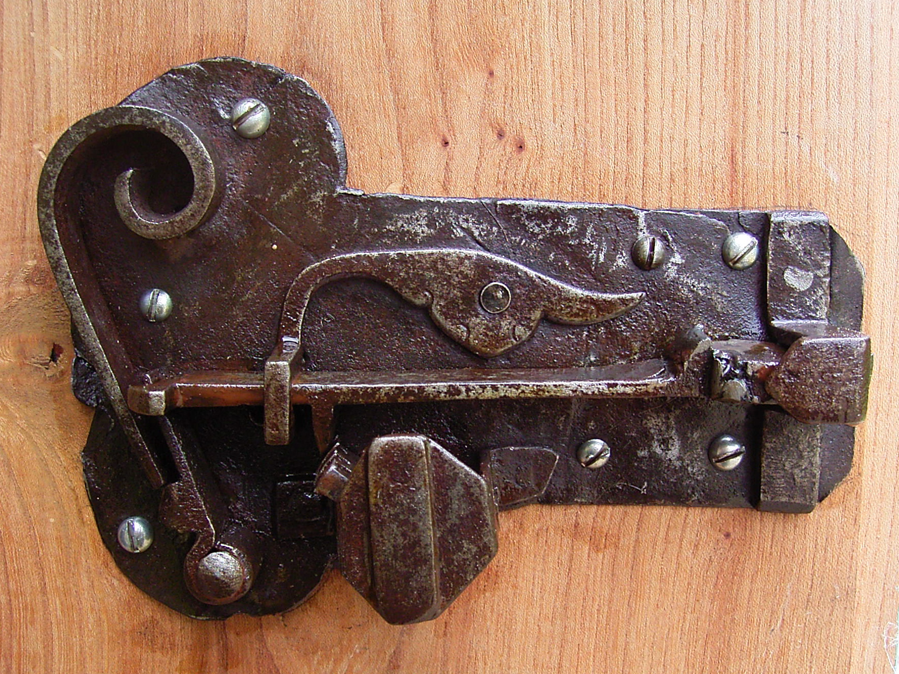 Ancient warded lock in open position